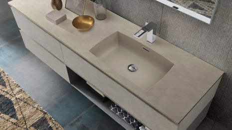 Solid surface taupe vanity with storage below