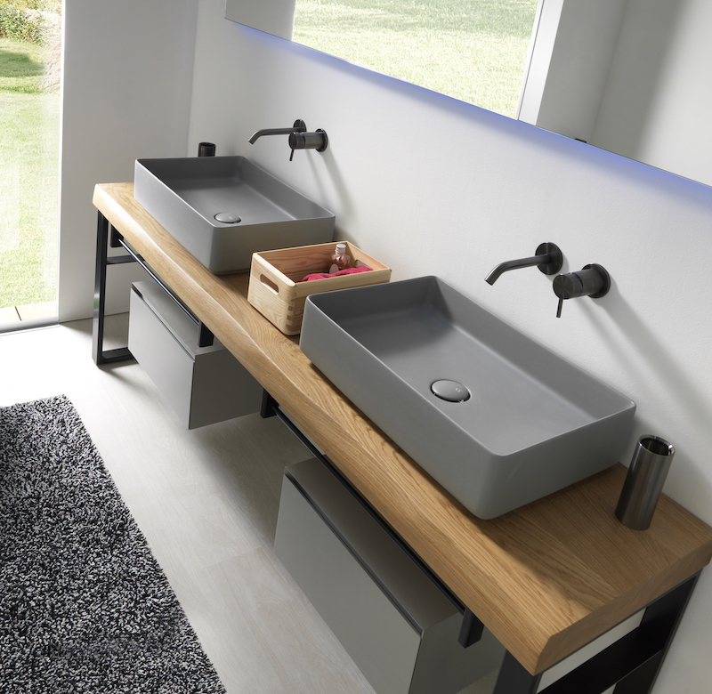 Double grey fly vessels on wood bathroom countertop