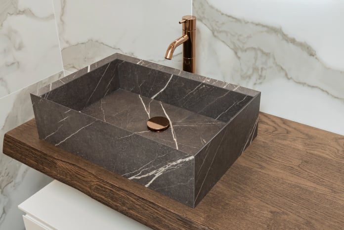 Gray marble bathroom sink vessel.